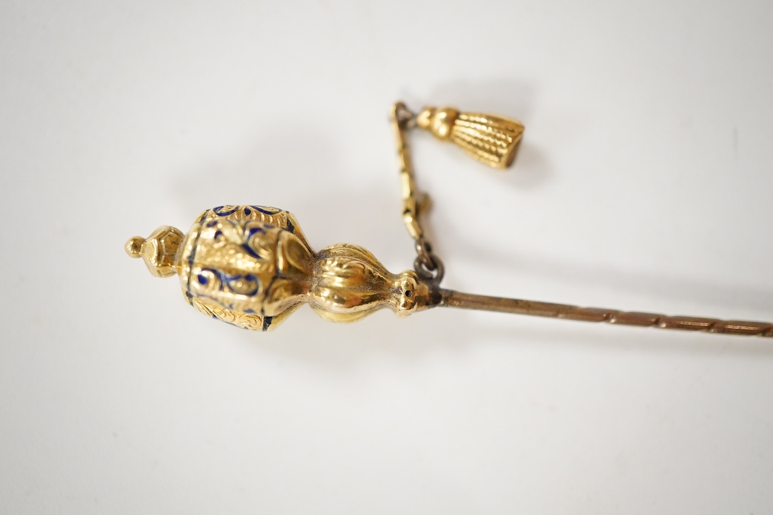 An early 20th century Viennese yellow metal, ruby, diamond and sapphire set 'clover' stick pin, 68mm, together with a yellow metal and blue enamel set stick pin.